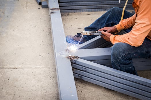 Close hand man arc welding or stick welding iron photo