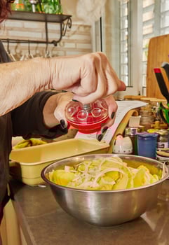 Chef prepares the ingredients for potato, zucchini, cauliflower and yellow cheese souffle photo