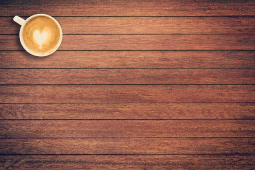 Coffee cup on wood texture and background with space. photo
