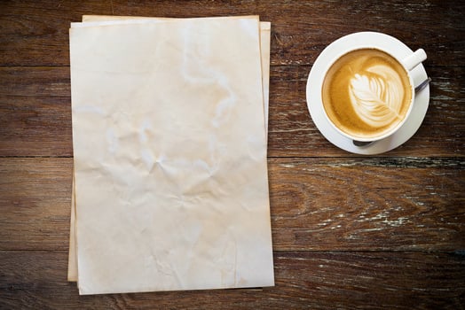 old paper and coffee on wood table with space. photo