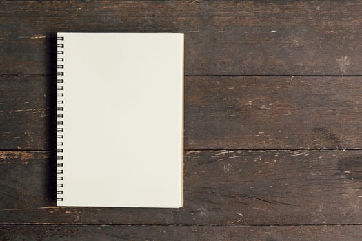Brown book open on wood table background with space. photo