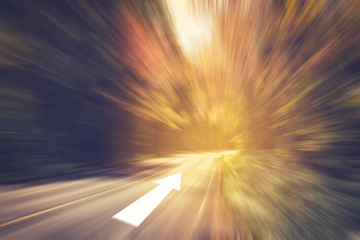 Abstract road motion blurred and highway speed with sunlight, vintage toned. photo