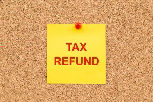 Yellow blank note and written TAX Refund for reminder. photo