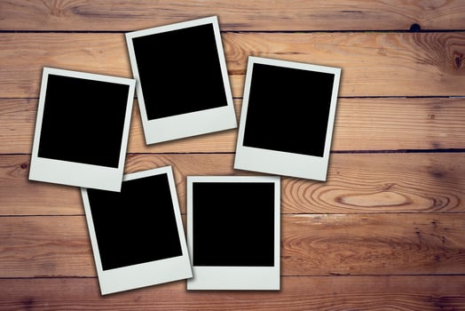 Blank photo frame on wood background and texture