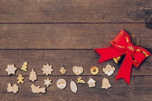 christmas decoration and red bow on wood background with copyspace. photo