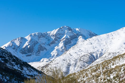 beautiful snow mountains with blue sky on a sunny day photo