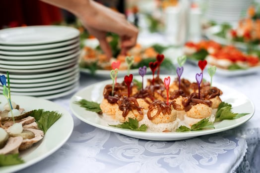 table set with light snacks, canapes and glasses photo
