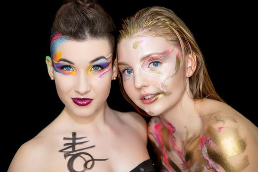 Two pretty young women with creative make-up photo