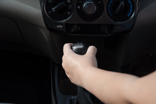 Driver hand shifting the gear stick,Hand on car gear knob.The driver switches the speed in the car. Hand on gear lever. photo
