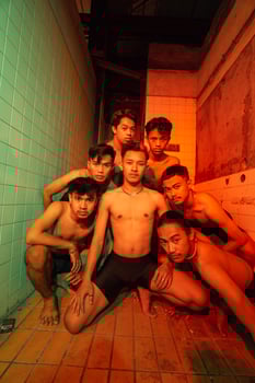 a group of naked gays are gathering and posing with their friends while celebrating world gay day photo