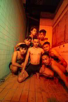 a group of naked gays are gathering and posing with their friends while celebrating world gay day photo
