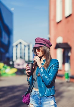 woman in the street drinking coffee photo