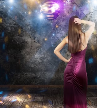 Girl dancing in a disco pub photo