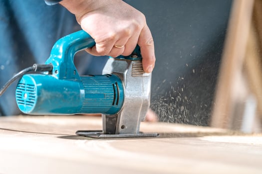 wood carving by hand with an electric saw photo