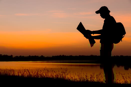 Male tourists standing by the telethon at sunset. photo