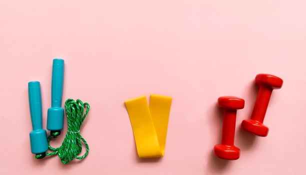Sport, fitness equipment on pink background. Flat lay composition photo