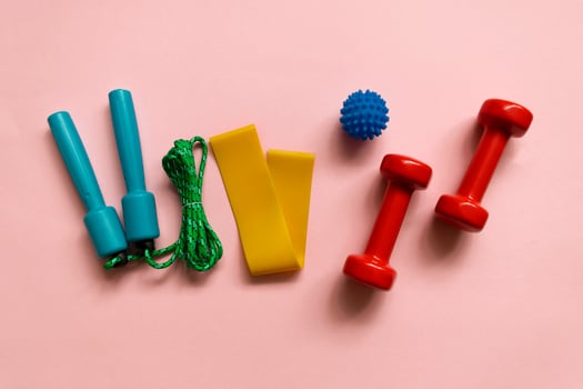 Sport, fitness equipment on pink background. Flat lay composition photo