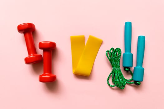 Sport, fitness equipment on pink background. Flat lay composition photo