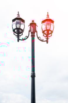 Street lamp retro on blue sky background photo