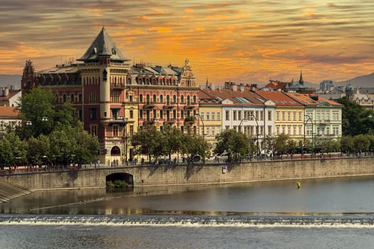 prague view cityscape from river at sunset photo