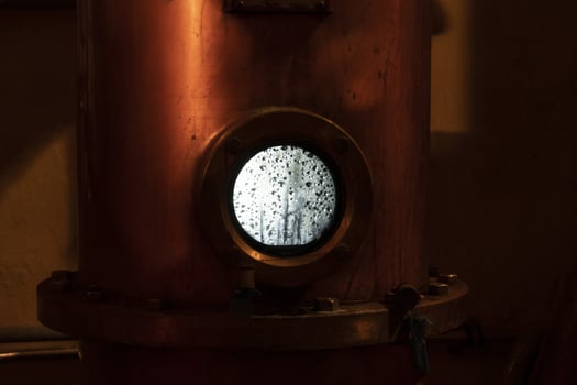 Copper alambic inside distillery photo