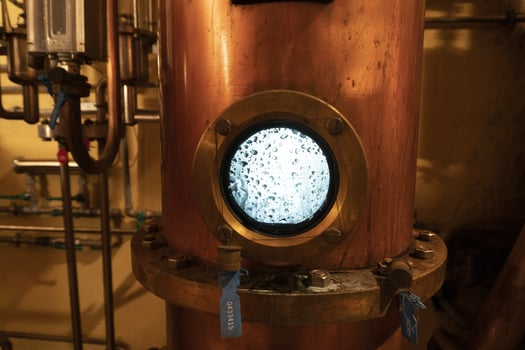 Copper alambic inside distillery photo