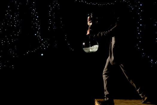 Man mixing spirits in ampoul photo