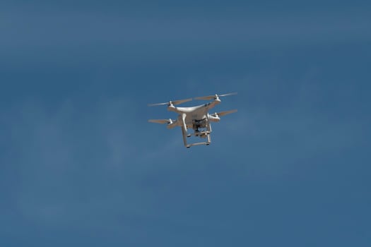 Drone isolated in blue sky photo
