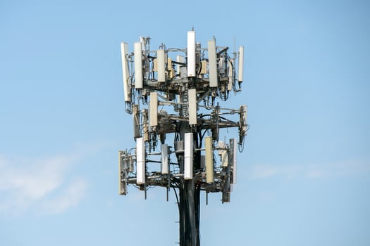 communication antenna on light blue sky photo