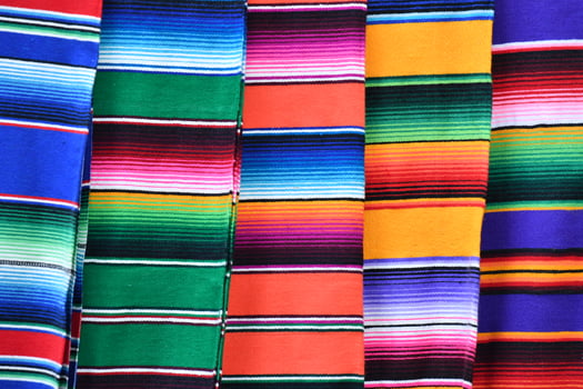 Different colors mexican fabric close up detail photo