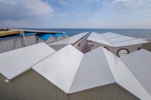 Bathhouse beach club preparation set up for summer season in Italy photo