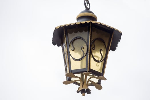 old lamppost detail isolated on white photo