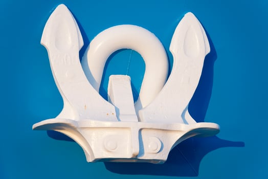 White Anchor on blue ship photo