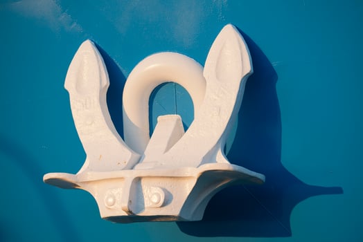 White Anchor on blue ship photo