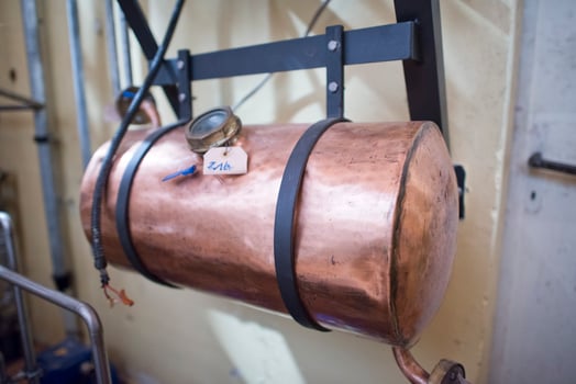 Copper still alembic inside distillery photo