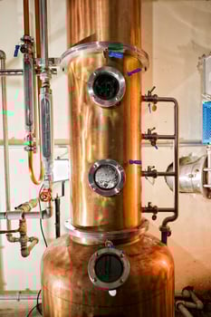 Copper still alembic inside distillery photo