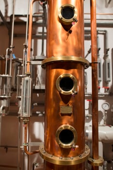 Copper still alembic inside distillery photo