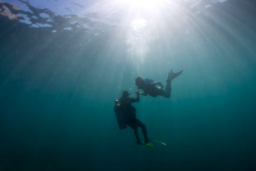 Mermaid meeting a diver underwater photo