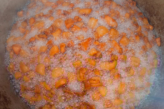A deep fry fying pan close up very hot with chips photo