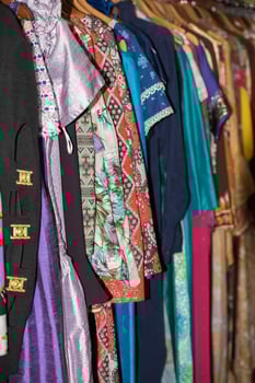 Vintage clothes for sale inside a shop photo
