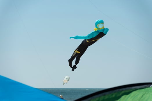 Scuba diver kite on the sky background photo
