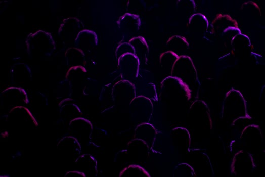 audience silhouette on black photo