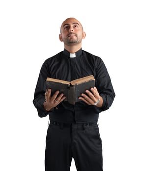 Priest praying on white background photo