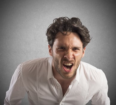Angry businessman screams photo