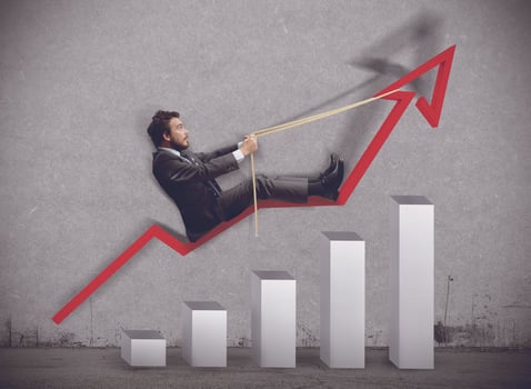 Businessman rides to the rise of economy photo