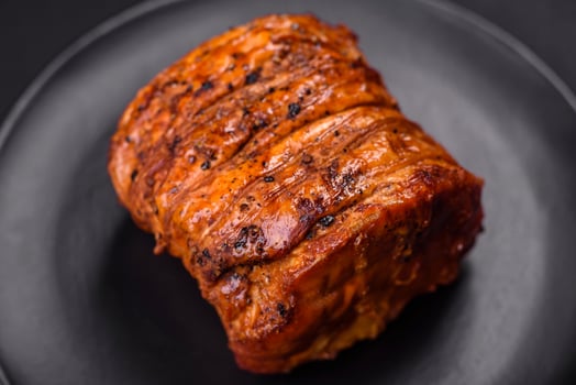 Delicious fresh smoked meat or ham with spices and herbs photo