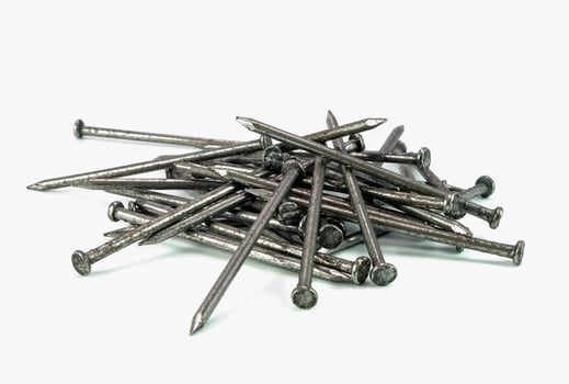 pile of steel nail on white background photo