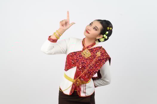Young beautiful woman dres local culture in southern point finger posture photo