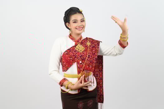 Asian pretty woman in northeastern dress stand in beautiful Thai dance photo