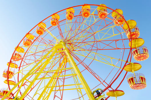 Ferris wheel on a background of blue clear sky photo